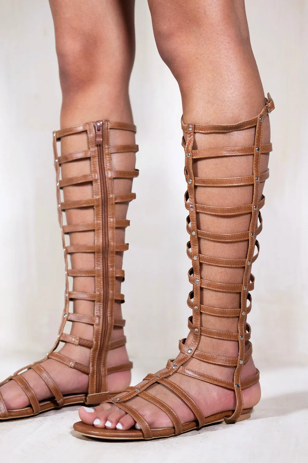 LEIA GLADIATOR KNEE HIGH FLAT SANDALS IN TAN FAUX LEATHER